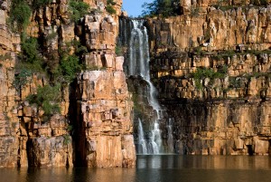 Waterfalls cascading down 100 feet rock faces